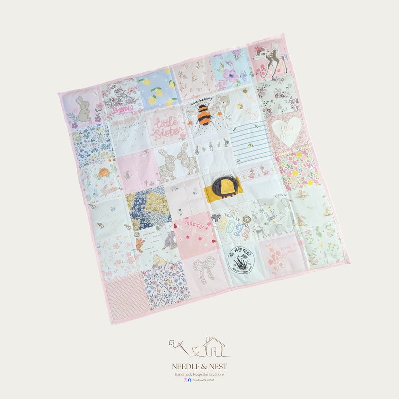 Handmade patchwork memory blanket by Needle and Nest made from baby girl clothing featuring bunny, bee, Bambi and floral prints with pink edging
