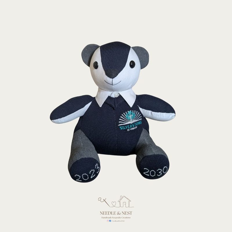 School uniform memory bear by Needle and Nest made from Silverstone CE Primary navy jumper with embroidered years 2023 and 2030